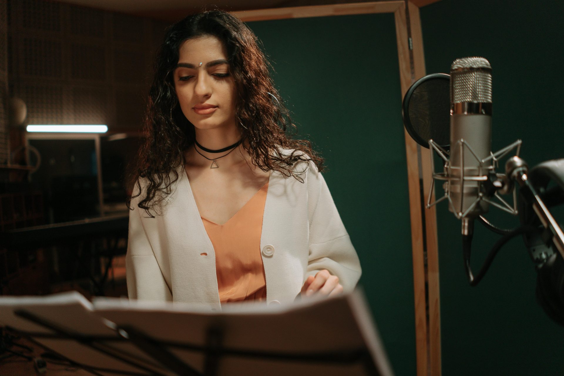 pexels-cottonbro-7086300 Female voice over artist in sound booth.