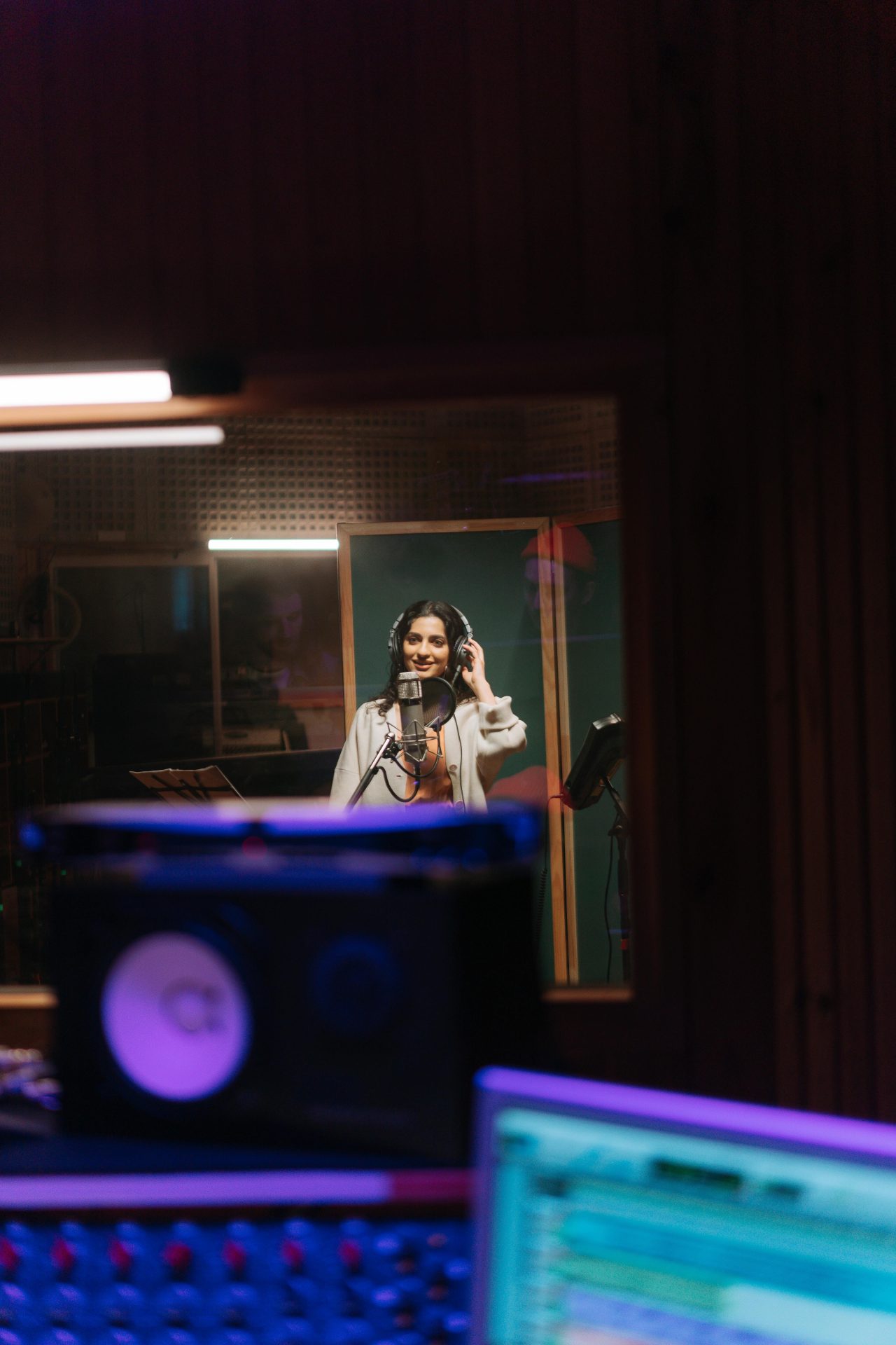 pexels-cottonbro-7087649 Voice over artist in a booth.