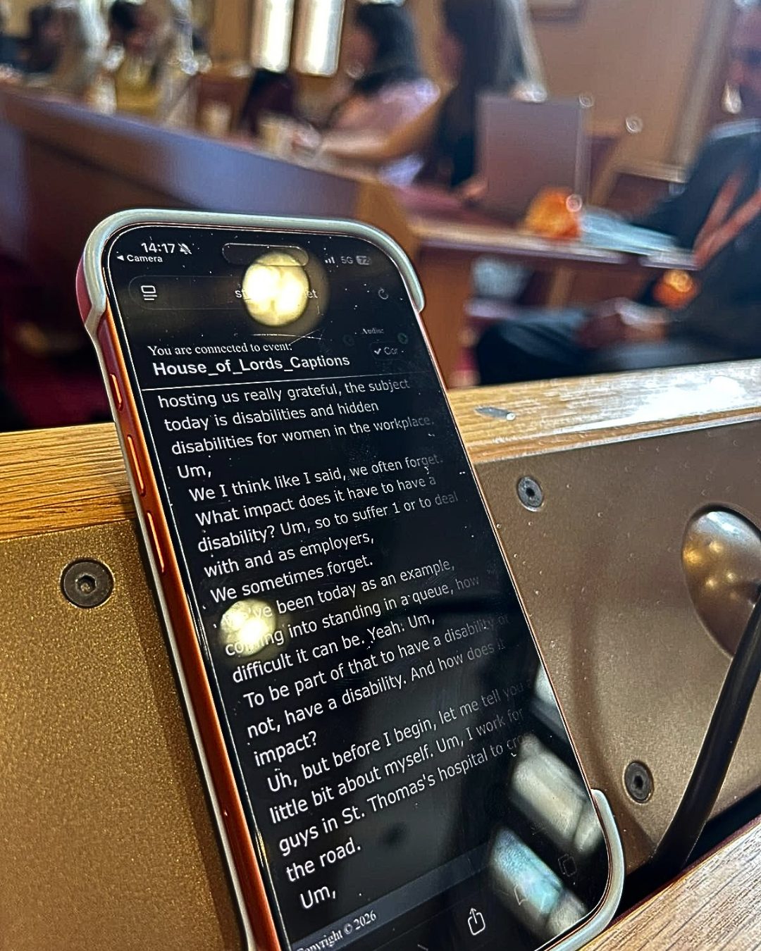 Soph AI LC AI Live Captions on an IPhone on a table in the House of Lords
